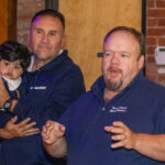 Dr. Frank Gerratana photo. Sen. Rick Lopes (D-6) speaks while Rep. Bobby Sanchez (D-25) listens.